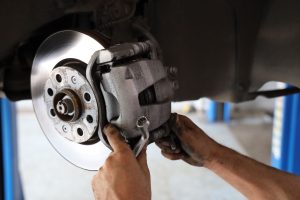 Brake pad replacement in car service